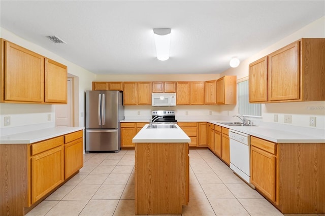 2670 S Palmetto Ridge Cir, Apopka, FL 32712 - kitchen featuring stainless steel appliances, an island with sink, light countertops, and light tile patterned floors