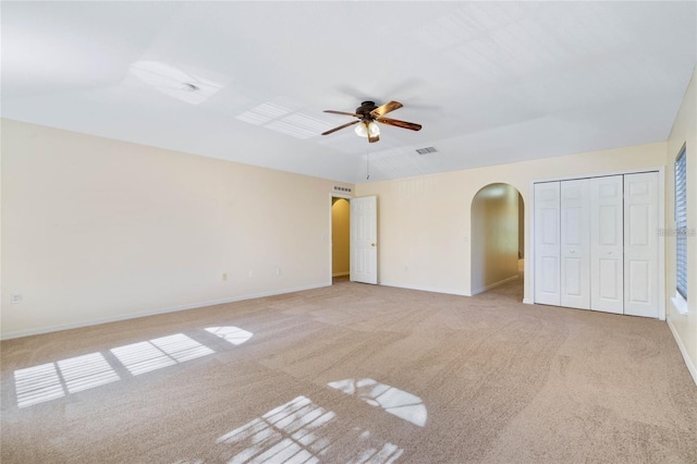 2670 S Palmetto Ridge Cir, Apopka, FL 32712 - unfurnished bedroom with arched walkways, carpet, and ceiling fan
