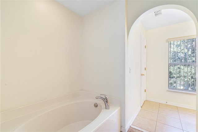 2670 S Palmetto Ridge Cir, Apopka, FL 32712 - bathroom with a bath and tile patterned flooring
