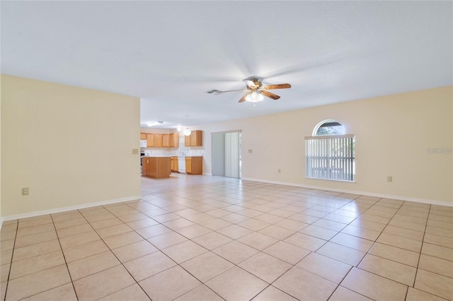 2670 S Palmetto Ridge Cir, Apopka, FL 32712 - unfurnished living room featuring a ceiling fan and light tile patterned floors