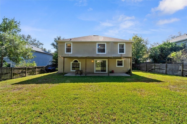 2670 S Palmetto Ridge Cir, Apopka, FL 32712 - back of property with a fenced backyard, a patio area, and stucco siding