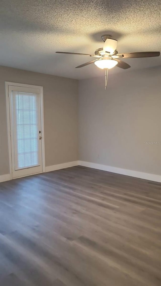 4400 Thornbriar Ln Unit A103, Orlando, FL 32822 - unfurnished room with wood finished floors, a ceiling fan, and a textured ceiling