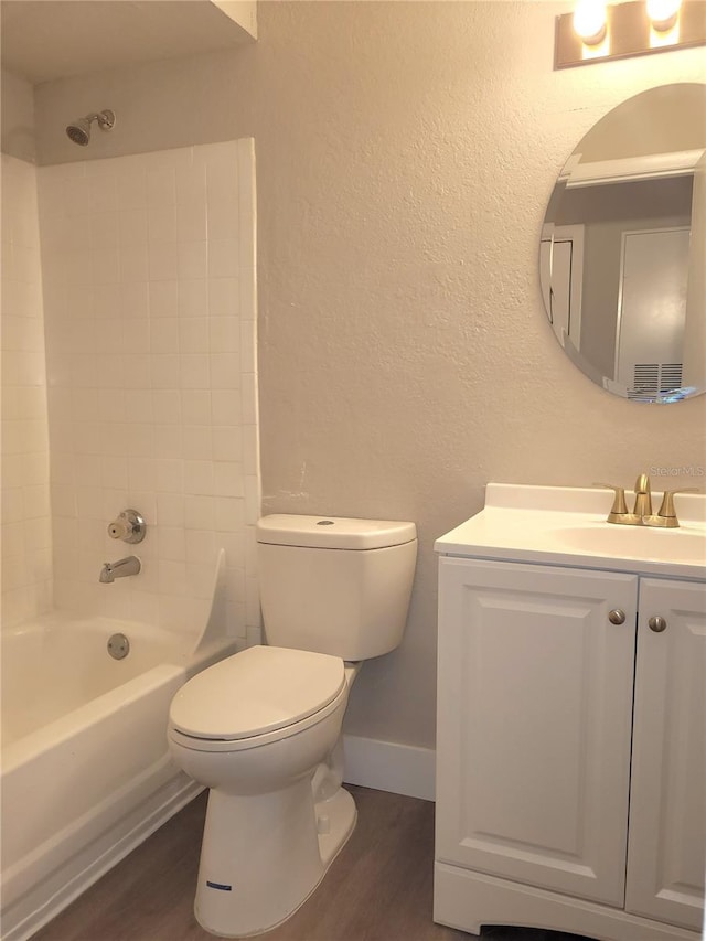 4400 Thornbriar Ln Unit A103, Orlando, FL 32822 - full bath with wood finished floors, vanity, shower / tub combination, and a textured wall