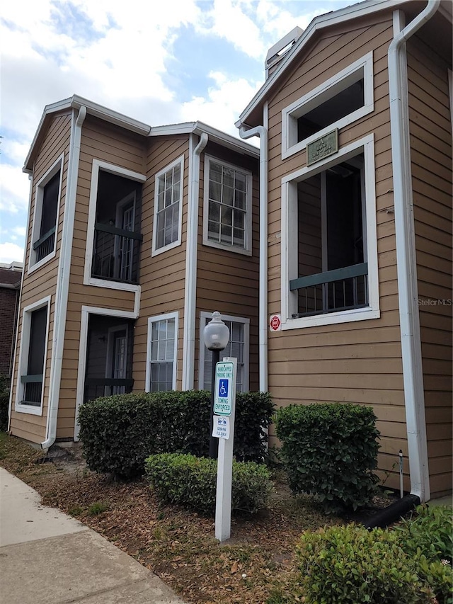 4400 Thornbriar Ln Unit A103, Orlando, FL 32822 - view of property exterior with a chimney