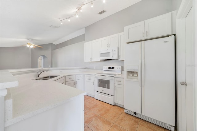938 Gateshead Ct, Kissimmee, FL 34758 - kitchen featuring white appliances, light tile patterned floors, a ceiling fan, white cabinets, and a peninsula