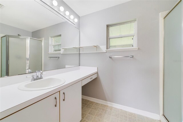 938 Gateshead Ct, Kissimmee, FL 34758 - full bathroom featuring vanity, a stall shower, and tile patterned floors