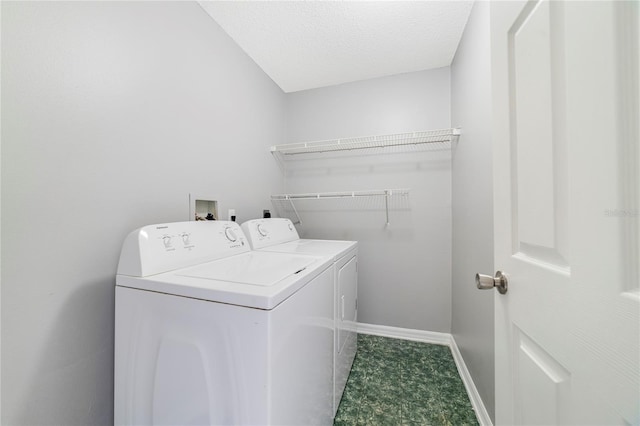 938 Gateshead Ct, Kissimmee, FL 34758 - laundry room with washer and clothes dryer and a textured ceiling