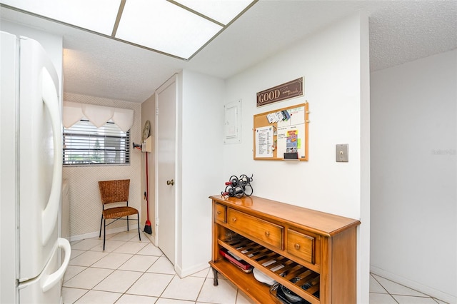 4570 Ocean Beach Blvd Unit 226, Cocoa Beach, FL 32931 - corridor with light tile patterned floors and a textured ceiling