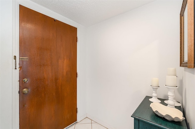 4570 Ocean Beach Blvd Unit 226, Cocoa Beach, FL 32931 - entrance foyer featuring light tile patterned flooring and a textured ceiling