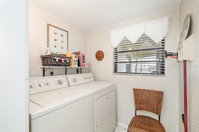 4570 Ocean Beach Blvd Unit 226, Cocoa Beach, FL 32931 - laundry area with independent washer and dryer and a textured ceiling