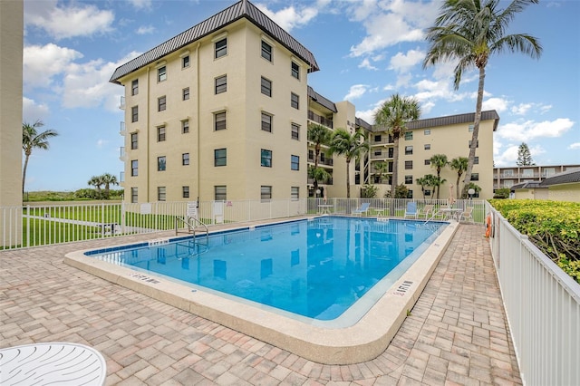4570 Ocean Beach Blvd Unit 226, Cocoa Beach, FL 32931 - community pool with a patio area