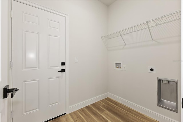 764 Marion Oaks Mnr, Ocala, FL 34473 - laundry area featuring hookup for a washing machine, electric dryer hookup, and wood finished floors