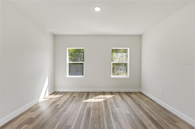 764 Marion Oaks Mnr, Ocala, FL 34473 - spare room featuring wood finished floors and recessed lighting