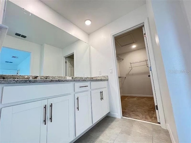 2343 Garden Belle Dr, Clermont, FL 34711 - full bathroom featuring double vanity and a spacious closet