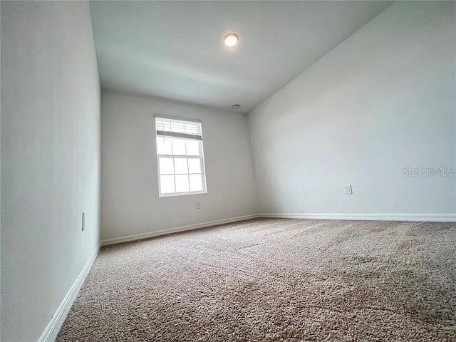 2343 Garden Belle Dr, Clermont, FL 34711 - carpeted empty room featuring baseboards