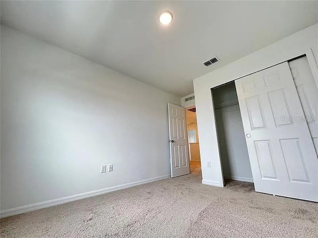 2343 Garden Belle Dr, Clermont, FL 34711 - unfurnished bedroom featuring light colored carpet and a closet