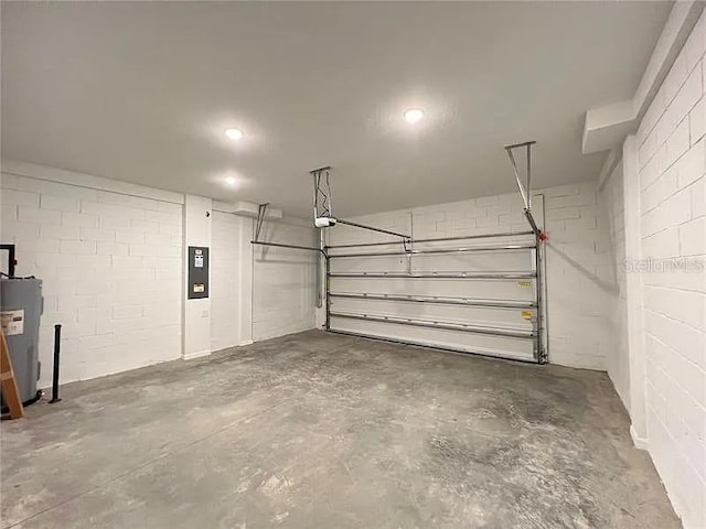 2343 Garden Belle Dr, Clermont, FL 34711 - garage with concrete block wall, water heater, and electric panel
