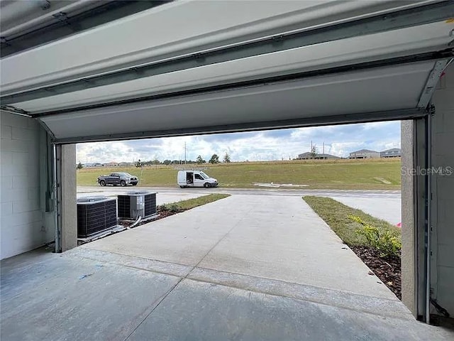 2343 Garden Belle Dr, Clermont, FL 34711 - garage with driveway and a carport