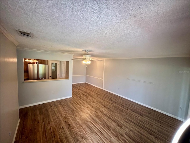 8131 Braddock Cir Unit 1, Port Richey, FL 34668 - spare room featuring a textured ceiling, a ceiling fan, wood finished floors, and crown molding