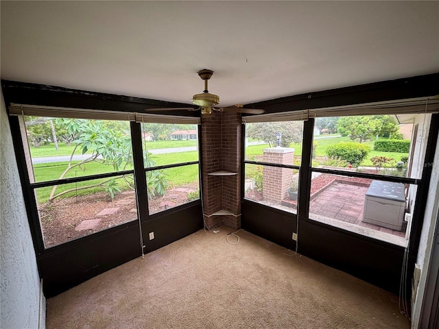 8131 Braddock Cir Unit 1, Port Richey, FL 34668 - unfurnished sunroom featuring carpet and ceiling fan