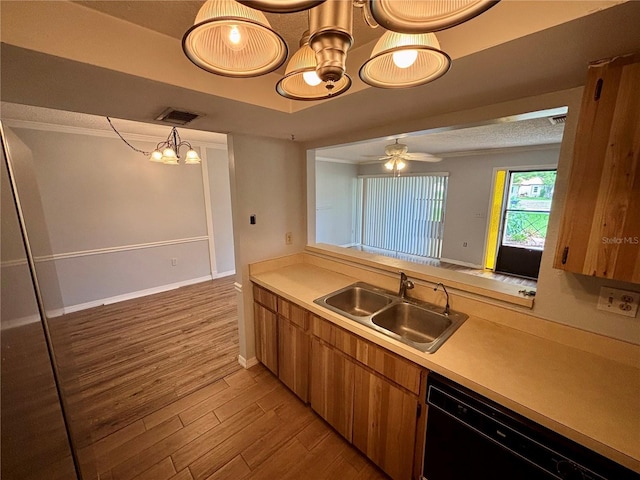 8131 Braddock Cir Unit 1, Port Richey, FL 34668 - kitchen with dishwasher, brown cabinets, light wood-type flooring, and light countertops