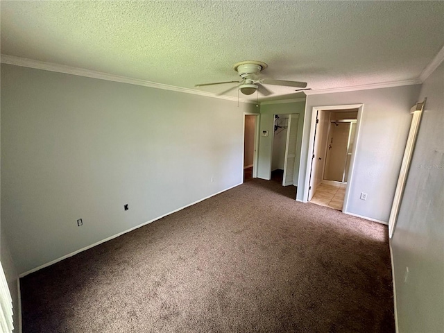 8131 Braddock Cir Unit 1, Port Richey, FL 34668 - unfurnished bedroom with carpet flooring, crown molding, a ceiling fan, ensuite bath, and a textured ceiling