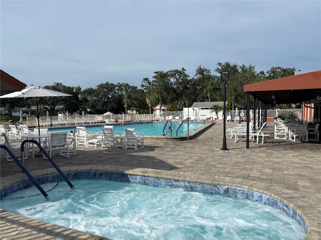 8131 Braddock Cir Unit 1, Port Richey, FL 34668 - community pool with a patio and a hot tub
