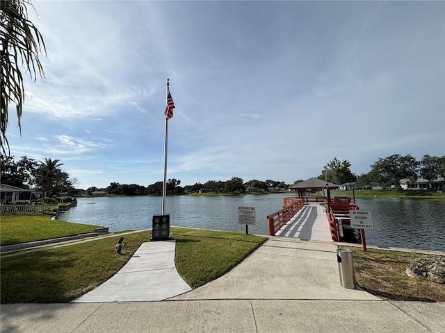 8131 Braddock Cir Unit 1, Port Richey, FL 34668 - dock featuring a gazebo, a water view, and a yard