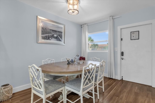 2790 Ocean Shore Blvd Unit 8N, Ormond Beach, FL 32176 - dining room featuring wood finished floors and baseboards