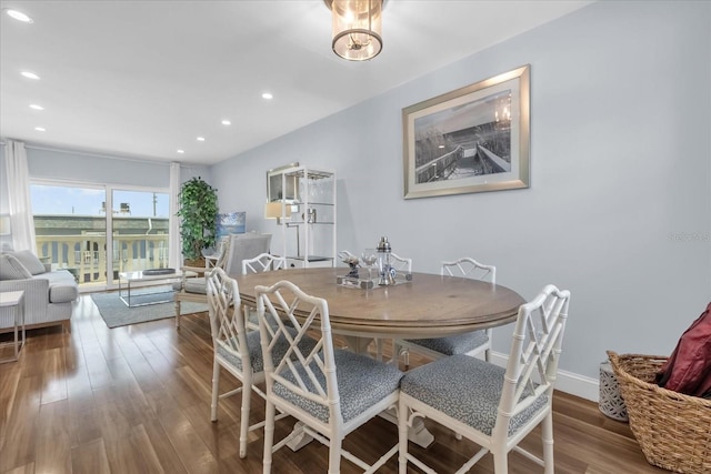 2790 Ocean Shore Blvd Unit 8N, Ormond Beach, FL 32176 - dining room featuring wood finished floors and recessed lighting