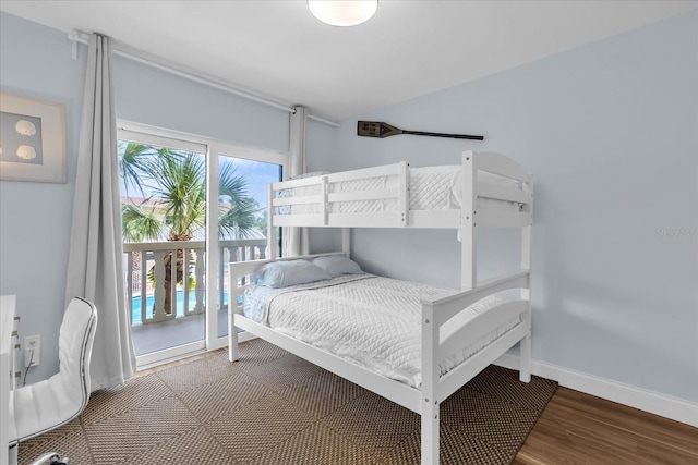2790 Ocean Shore Blvd Unit 8N, Ormond Beach, FL 32176 - bedroom with wood finished floors and baseboards