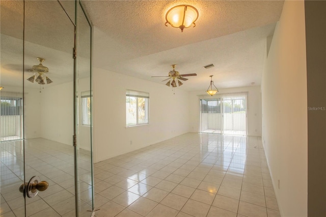 1711 SW 116th Way, Miramar, FL 33025 - spare room with ceiling fan, healthy amount of natural light, a textured ceiling, and light tile patterned floors