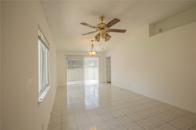 1711 SW 116th Way, Miramar, FL 33025 - unfurnished room featuring healthy amount of natural light, a ceiling fan, light tile patterned floors, and a textured ceiling
