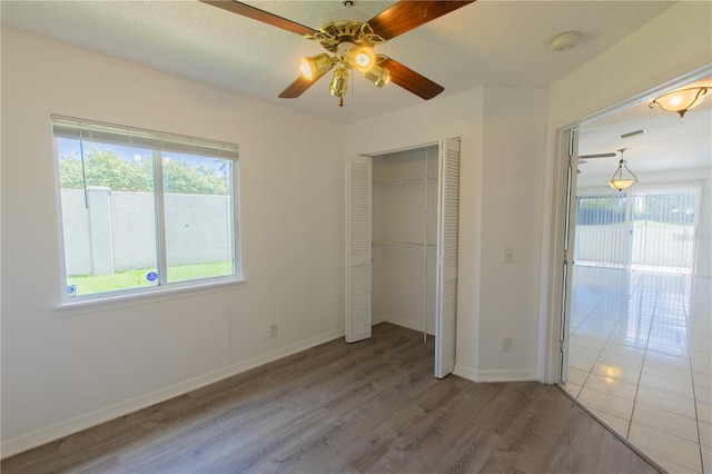 1711 SW 116th Way, Miramar, FL 33025 - unfurnished bedroom with wood finished floors, a closet, and a ceiling fan