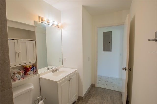 1711 SW 116th Way, Miramar, FL 33025 - half bath with vanity, electric panel, and wood finished floors