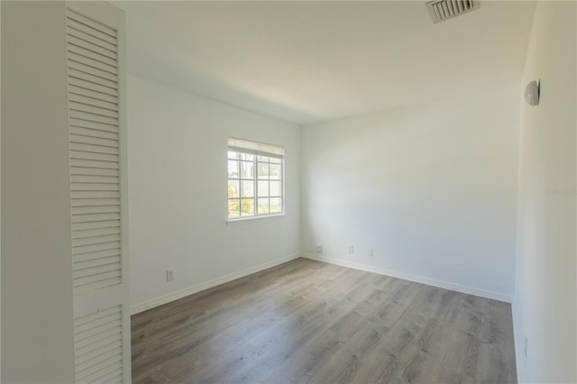 1711 SW 116th Way, Miramar, FL 33025 - empty room featuring wood finished floors and baseboards