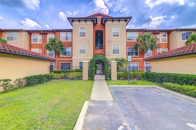 5554 Metrowest Blvd Unit 305, Orlando, FL 32811 - view of property with uncovered parking