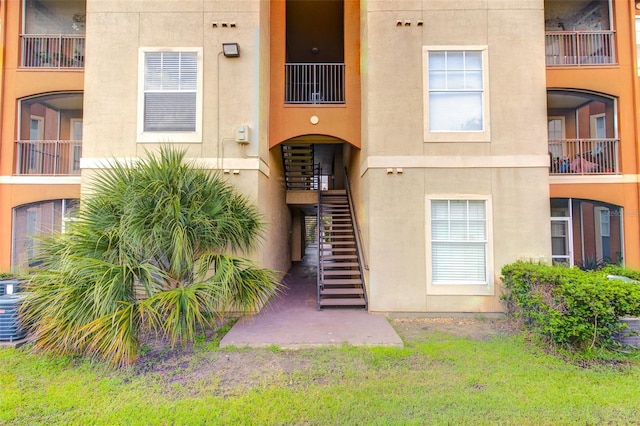 5554 Metrowest Blvd Unit 305, Orlando, FL 32811 - view of apartment building / complex featuring stairway