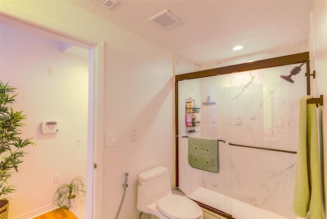 5554 Metrowest Blvd Unit 305, Orlando, FL 32811 - bathroom with a marble finish shower, wood finished floors, and recessed lighting