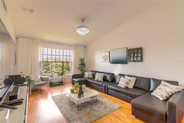 5554 Metrowest Blvd Unit 305, Orlando, FL 32811 - living room with wood finished floors and vaulted ceiling