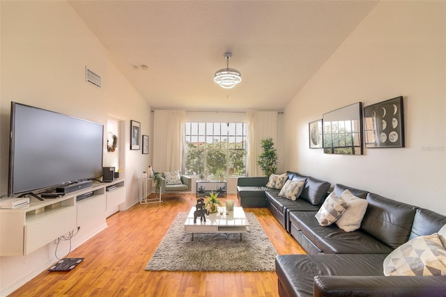 5554 Metrowest Blvd Unit 305, Orlando, FL 32811 - living area featuring lofted ceiling and light wood finished floors