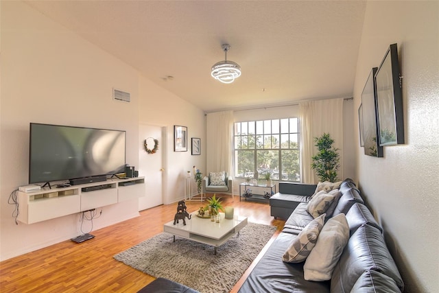 5554 Metrowest Blvd Unit 305, Orlando, FL 32811 - living room with wood finished floors and lofted ceiling