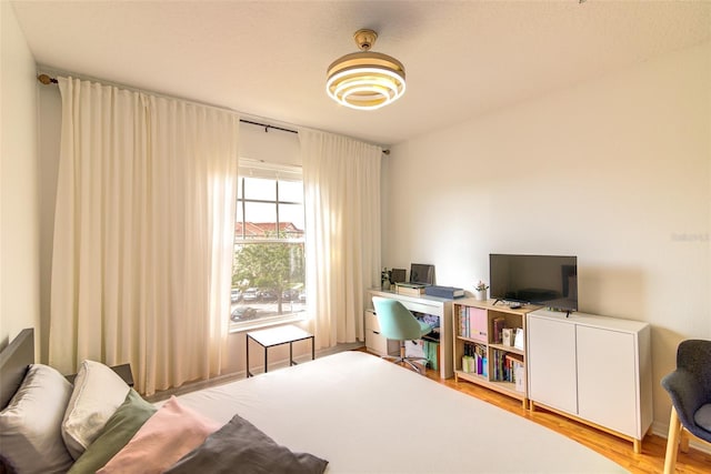 5554 Metrowest Blvd Unit 305, Orlando, FL 32811 - bedroom with wood finished floors