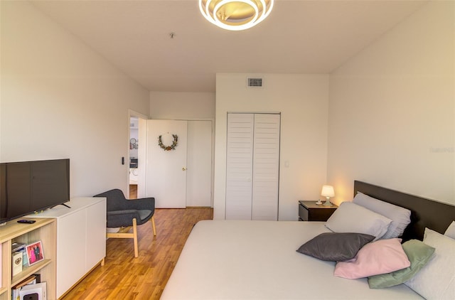 5554 Metrowest Blvd Unit 305, Orlando, FL 32811 - bedroom with light wood-style flooring and a closet