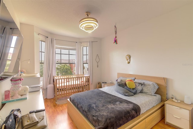 5554 Metrowest Blvd Unit 305, Orlando, FL 32811 - bedroom with multiple windows and light wood-type flooring