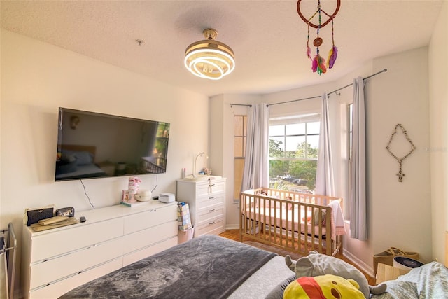 5554 Metrowest Blvd Unit 305, Orlando, FL 32811 - bedroom featuring a textured ceiling