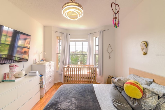 5554 Metrowest Blvd Unit 305, Orlando, FL 32811 - bedroom with light wood-type flooring