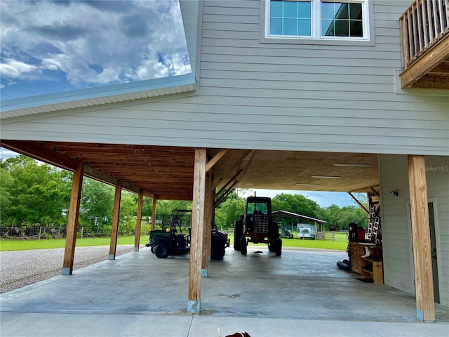 view of car parking with a yard and a carport