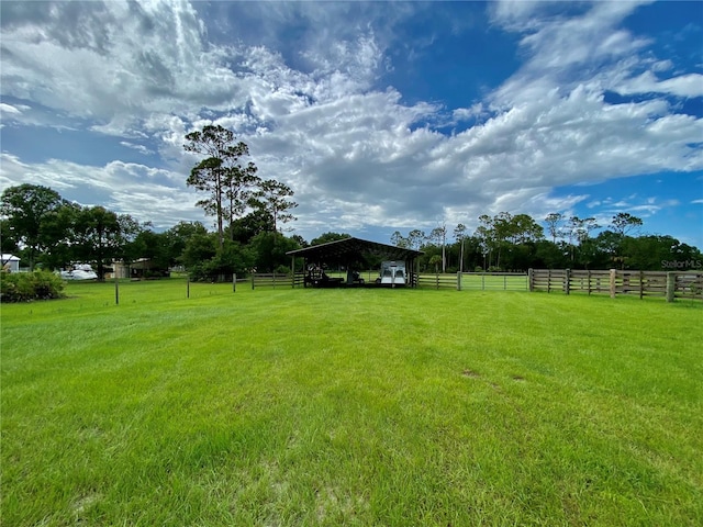 view of yard with a rural view