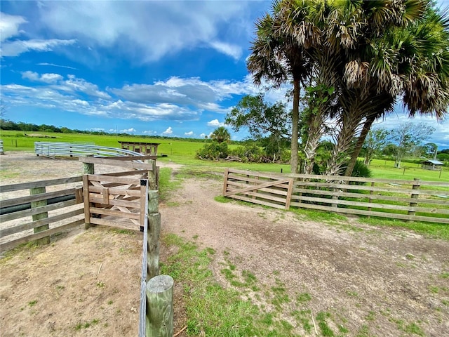 exterior space with a rural view and a yard